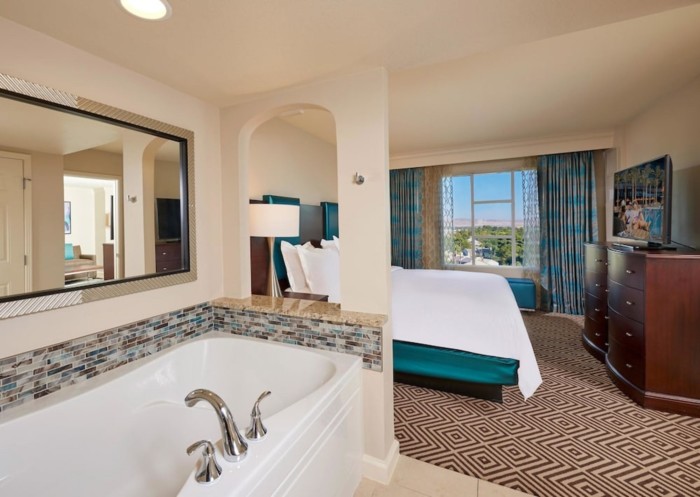 https://suiteness.imgix.net/destinations/las-vegas/hilton-grand-vacations-on-paradise-convention-center-/suites/2-bedroom-1-king-2-queens-suite-with-sofabed/bedroom.jpg?w=96px&h=64px&crop=edges&auto=compress,format